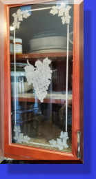 Customer Had the Wood Inserts removed and Replaced with Etched Glass Grape Vine Patterns. 