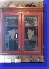 Customer Had the Wood Inserts removed and Replaced with Etched Glass Grape Vine Patterns. 