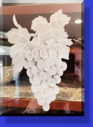 Customer Had the Wood Inserts removed and Replaced with Etched Glass Grape Vine Patterns. 